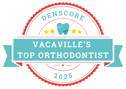 Award badge reading "Vacaville's Top Orthodontist 2025" with a tooth icon and stars, issued by Denscore.