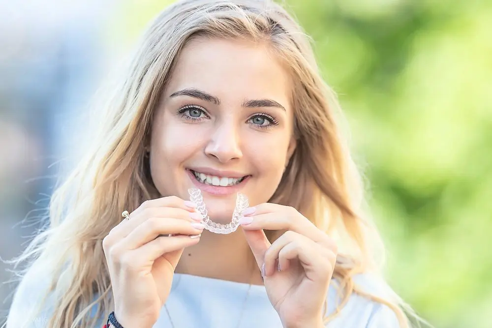 invisalign clear aligners orthodontics concept young attractive woman - How Does Invisalign Work in Vacaville, CA 